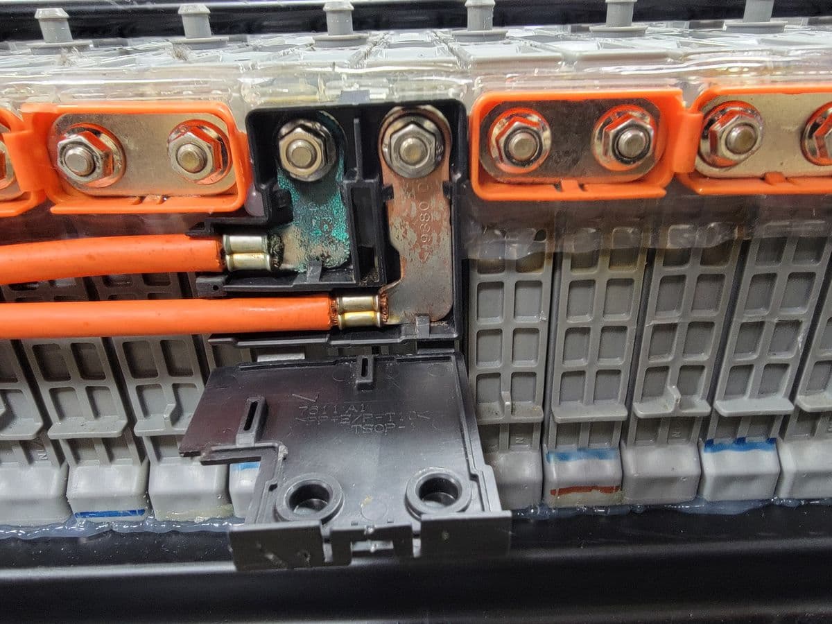 Battery busbars exposed during hybrid battery work at Atomic Auto
