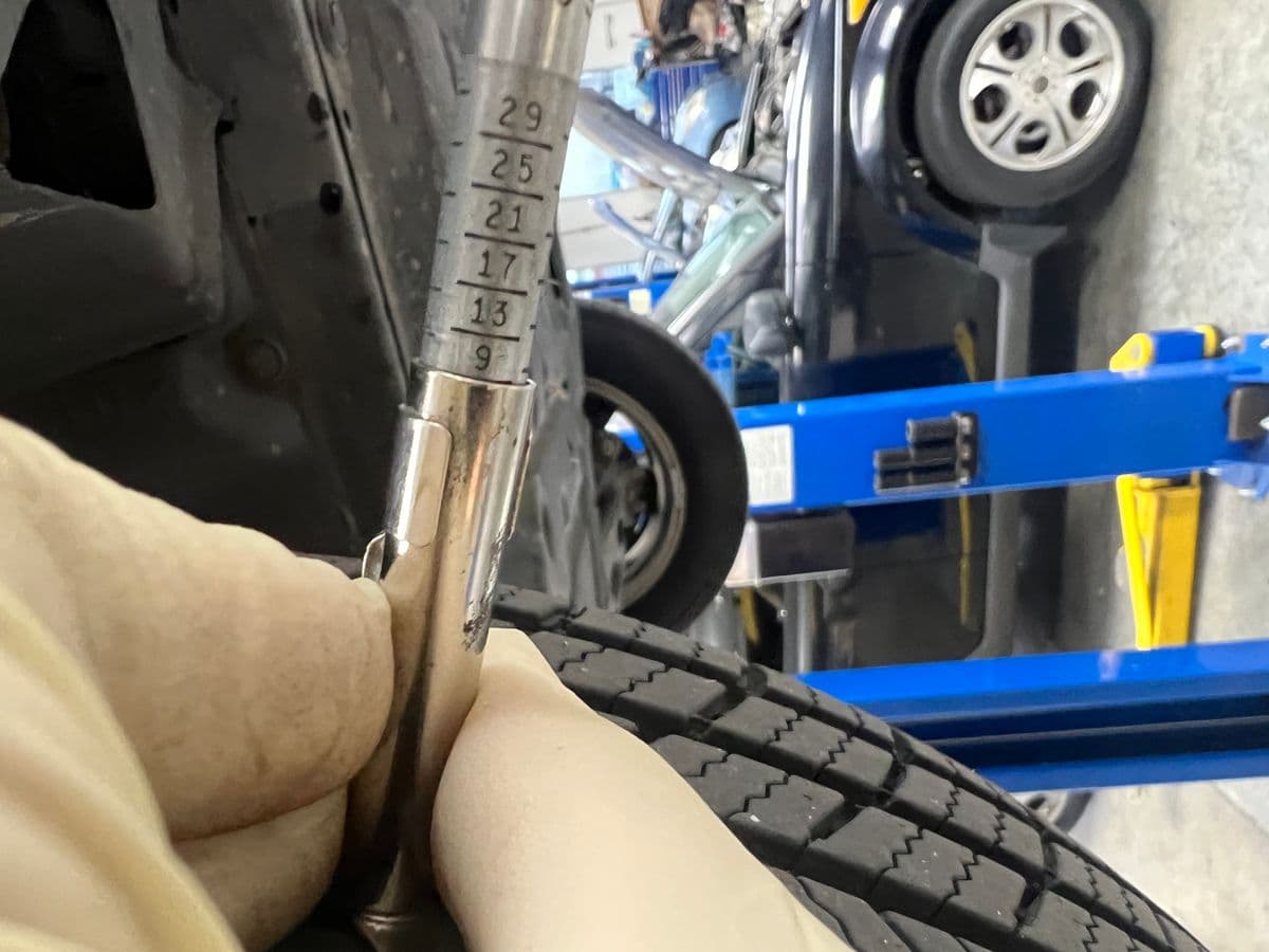 Checking a tire and brakes at Atomic Auto