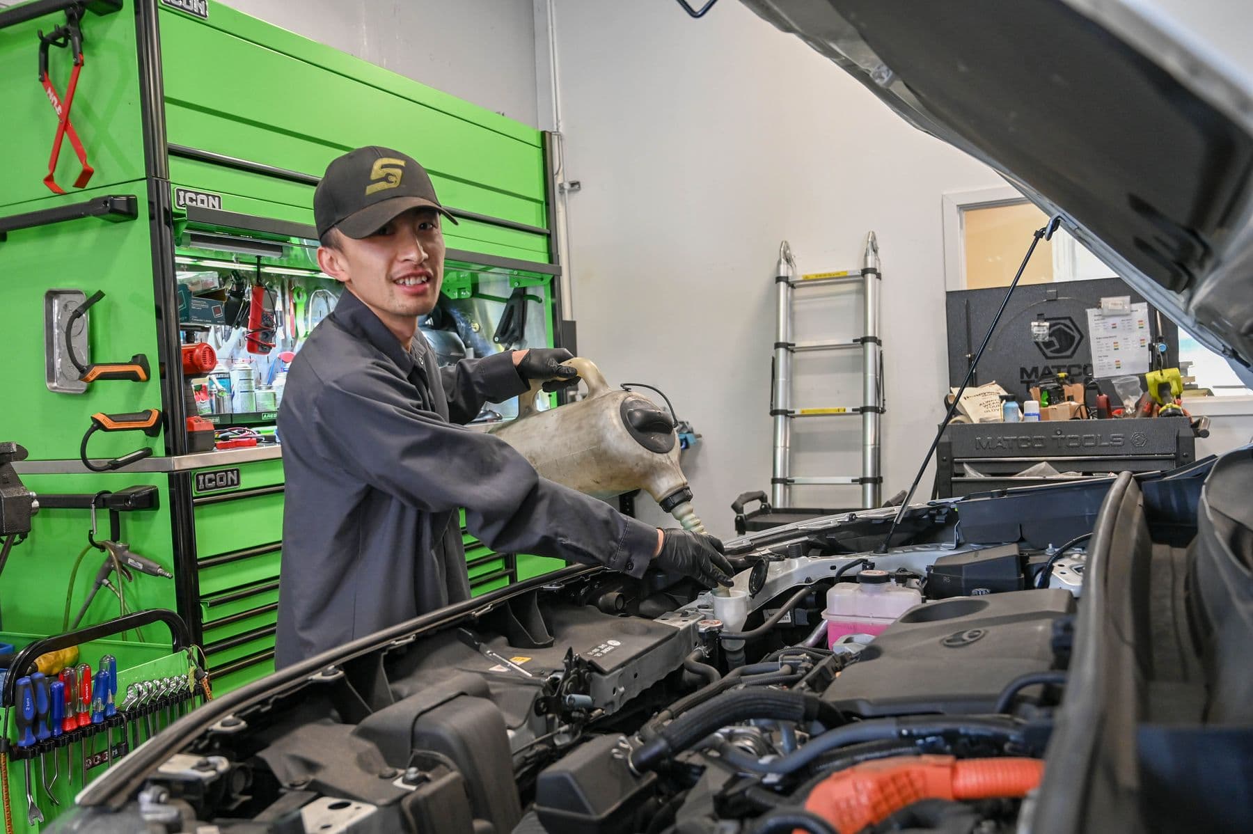 Coolant service under the hood at Earthling Automotive