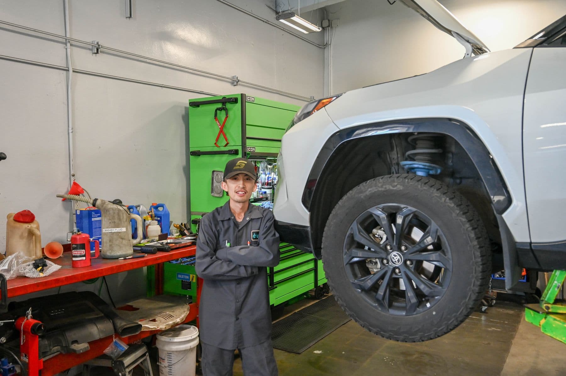A technician working on a RAV4 at Earthling Automotive