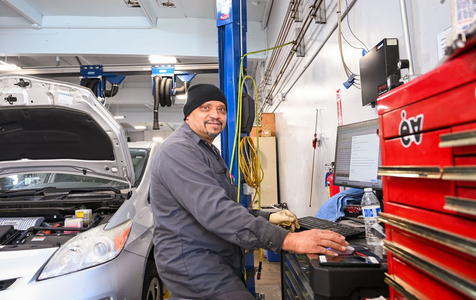 A technician at his toolbox at Earthling Automotive