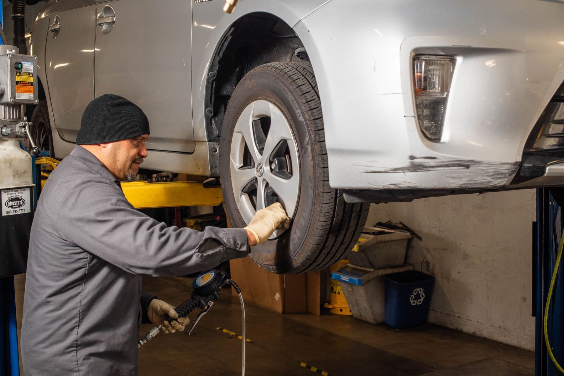 A wheel off the car for brake work at Earthling Automotive