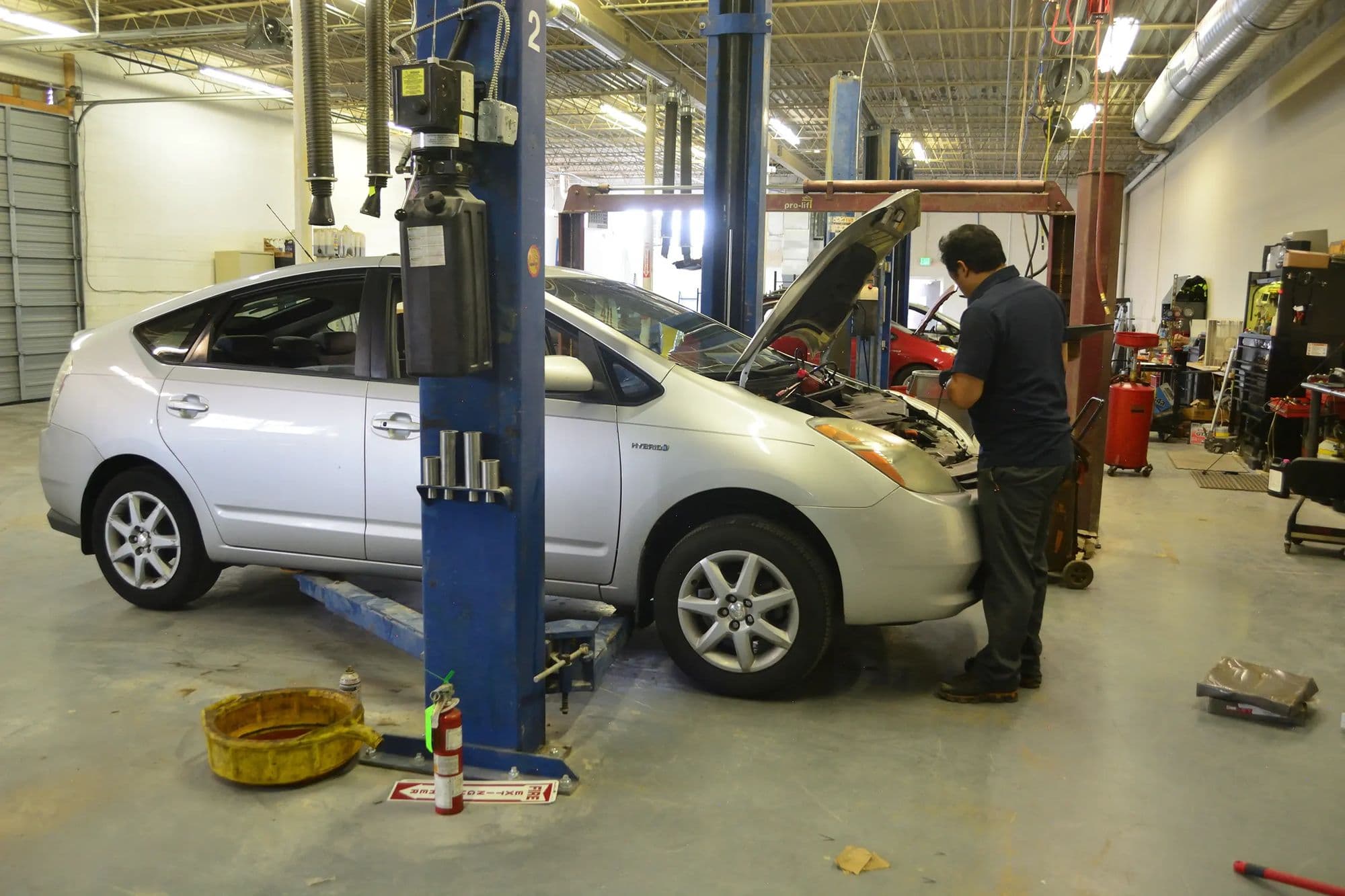 A Prius up on the lift at Mile Hybrid