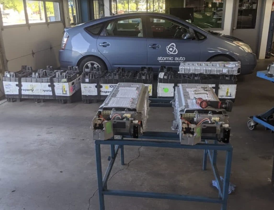 Hybrid battery work on the bench at Atomic Auto