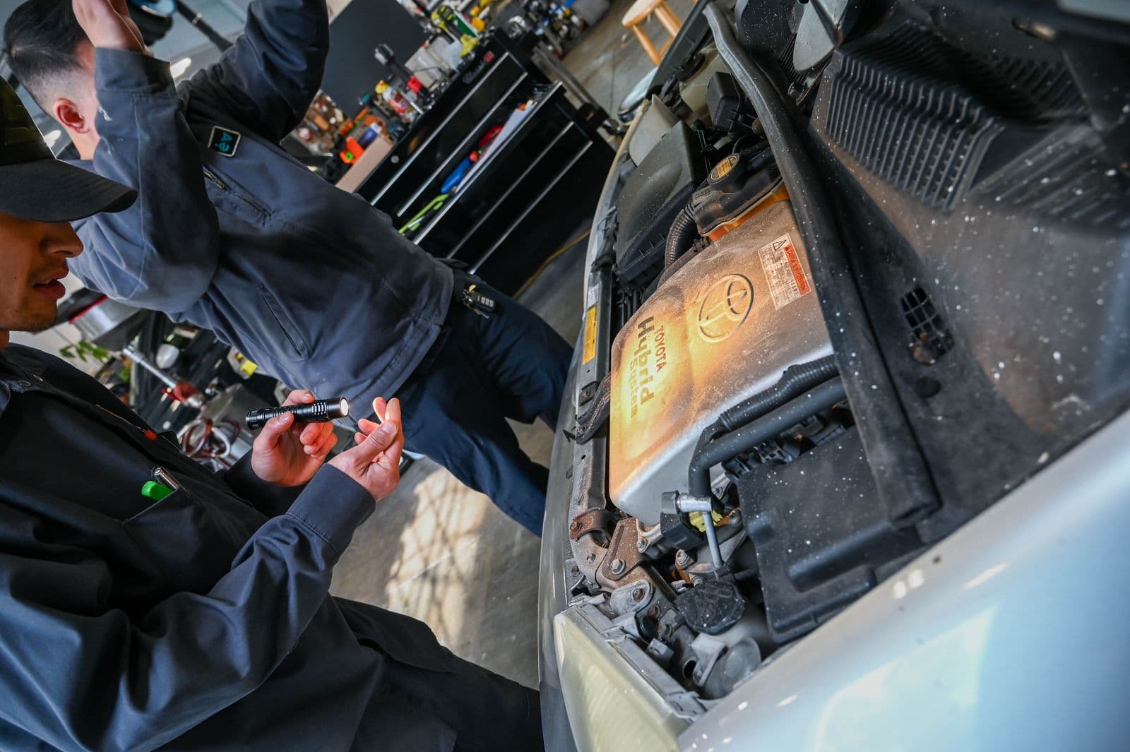 A hybrid on the lift in Earthling Automotive's bay