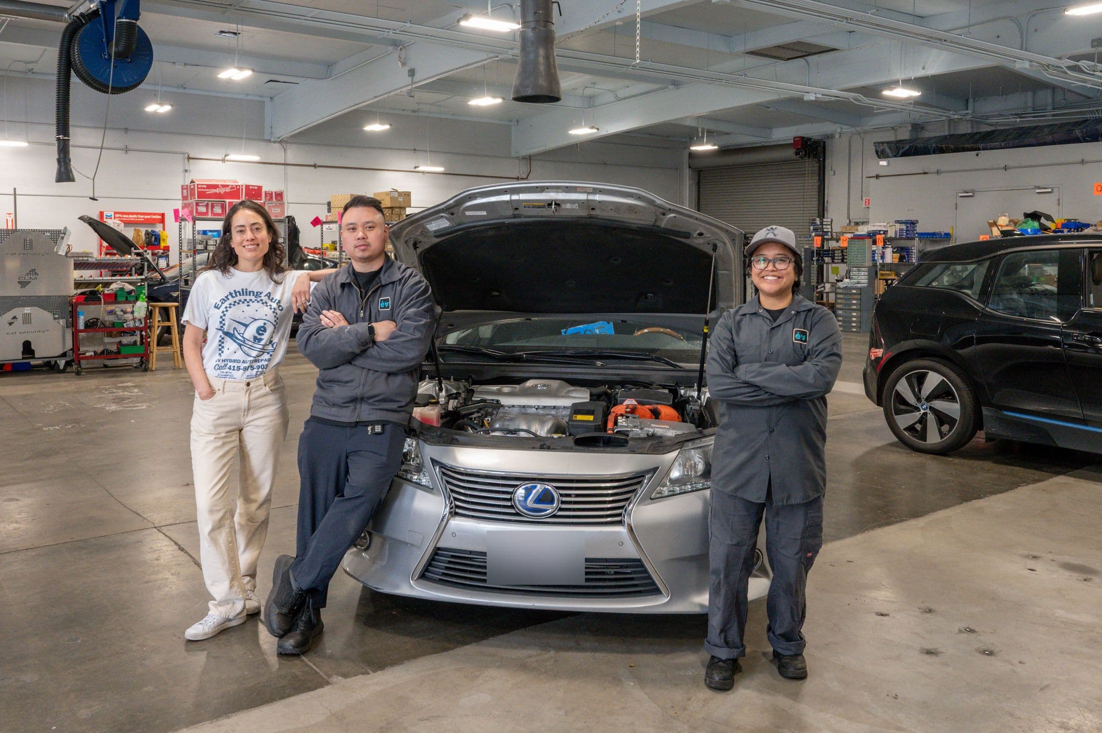 The Earthling Automotive crew with a Lexus hybrid