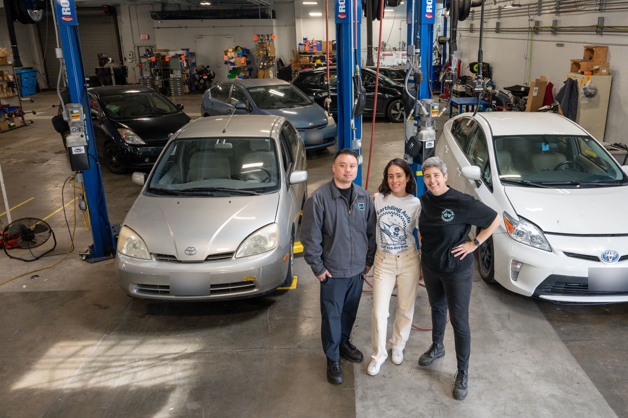 Three Priuses in the bay at Earthling Automotive