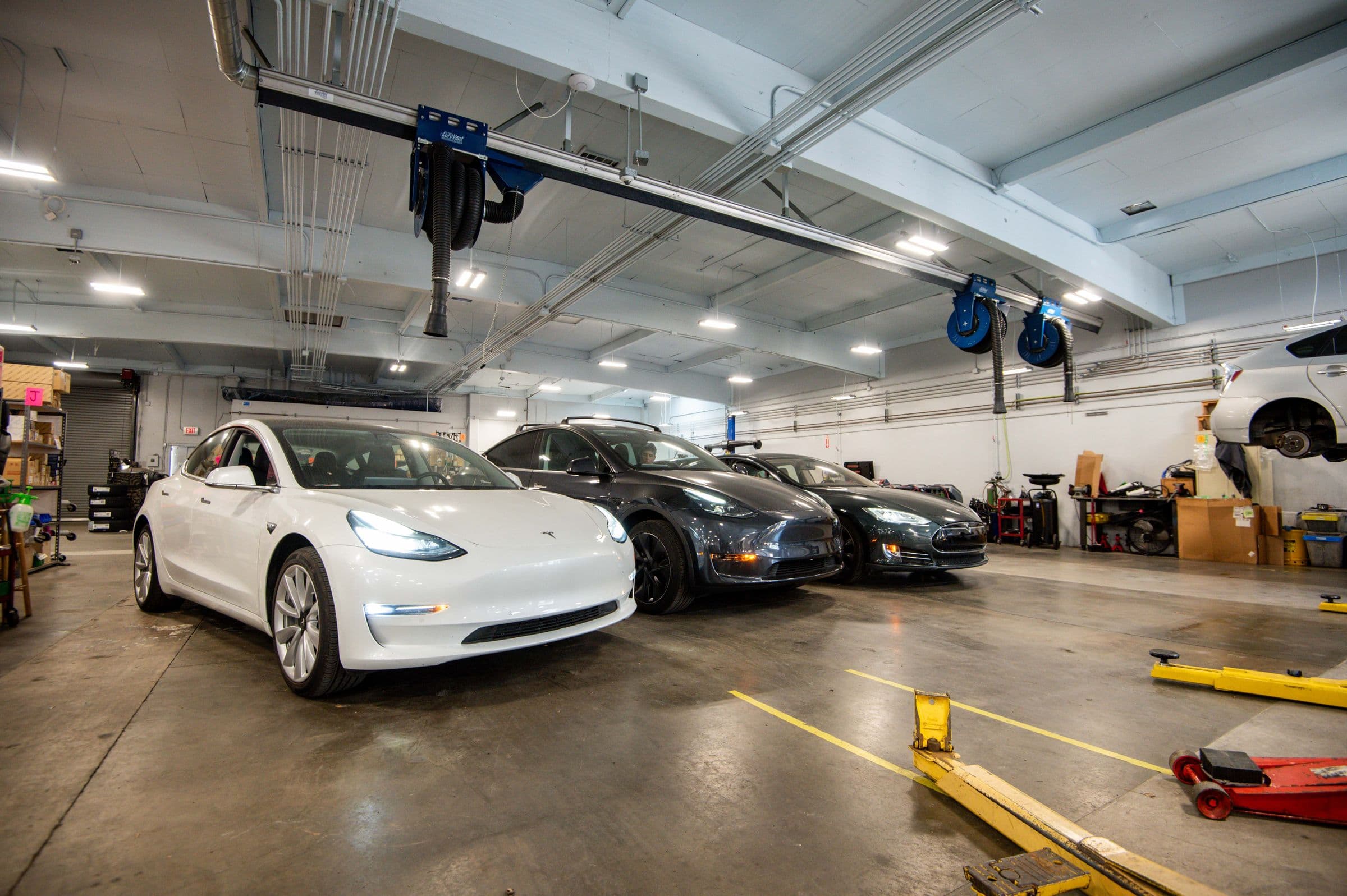 Electric cars in the bay at Earthling Automotive